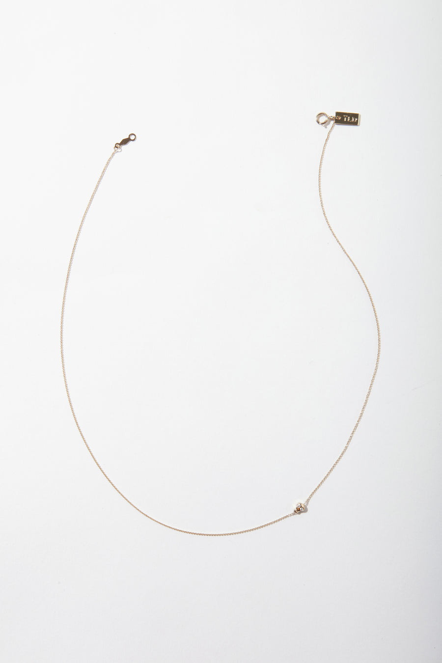 Tiny Skully Necklace with Diamond Eyes